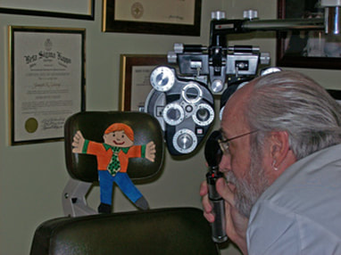 Dr. Young gives Flat Stanley an eye exam